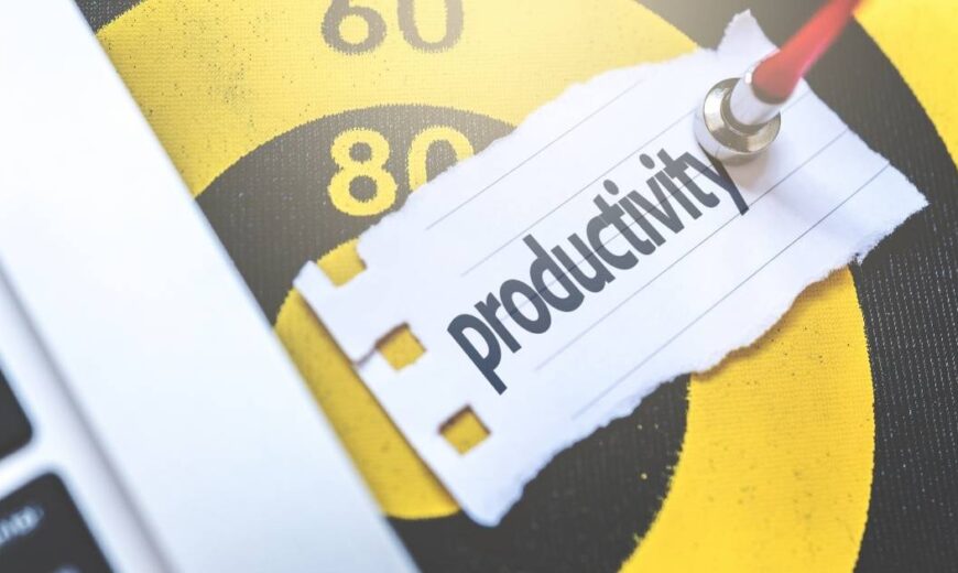 A yellow and black Target pointed by a dart with a piece of paper with written "Productivity"