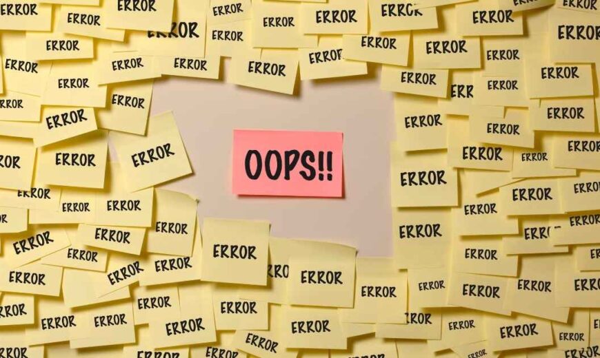 Wall full of yellow post-it with "error" written inside and one with written "OPS"