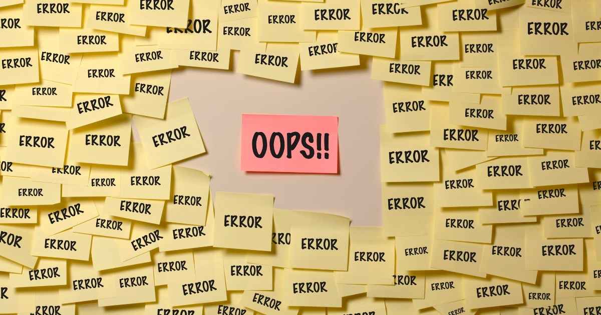 Wall full of yellow post-it with "error" written inside and one with written "OPS"