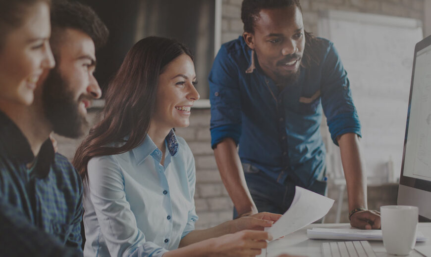 Group of Entrepreneurs guided by a teacher while watching a screen studying AI
